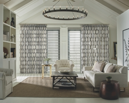 Living room in Denver CO with Hunter Douglas motorized drapes installed by AIM Home Automation