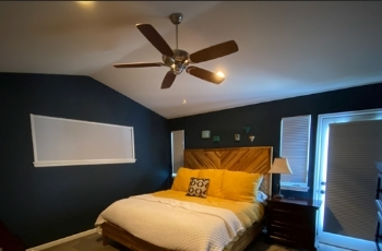Motorized honeycomb blackout shades in denver bedroom