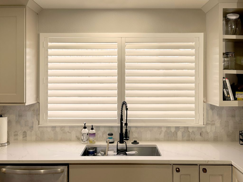 Hunter Douglas Palm Beach Polysatin Shutters featuring Hidden Tilt and Z Frame installation in Boulder kitchen