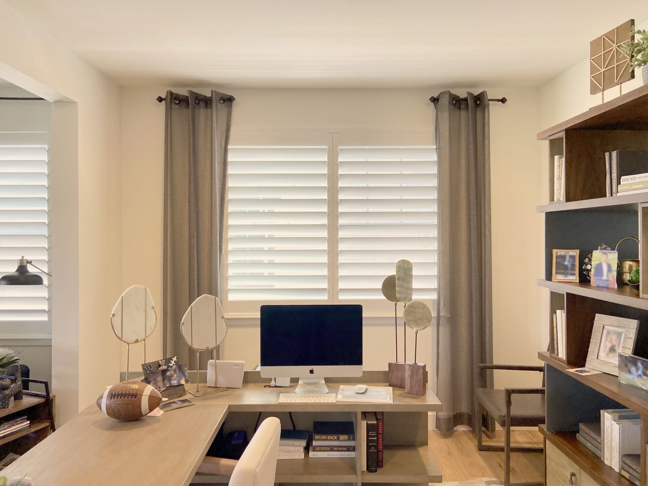 Hunter Douglas Palm Beach Polysatin Shutters with Hidden Tilt system and Z Frame paired with curtains for Centennial home