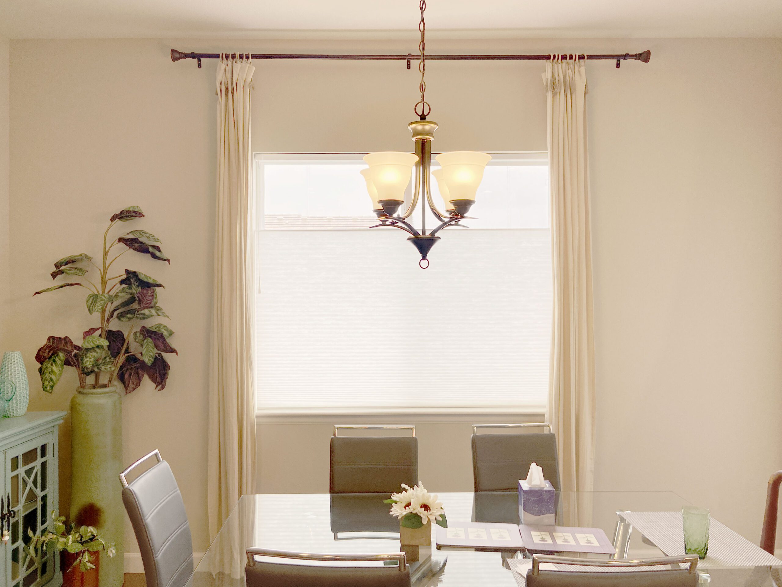 Hunter Douglas Applause Cellular Shades with UltraGlide operation, Top-Down/Bottom-Up functionality, and light-filtering fabric paired with curtains in Colorado Springs home
