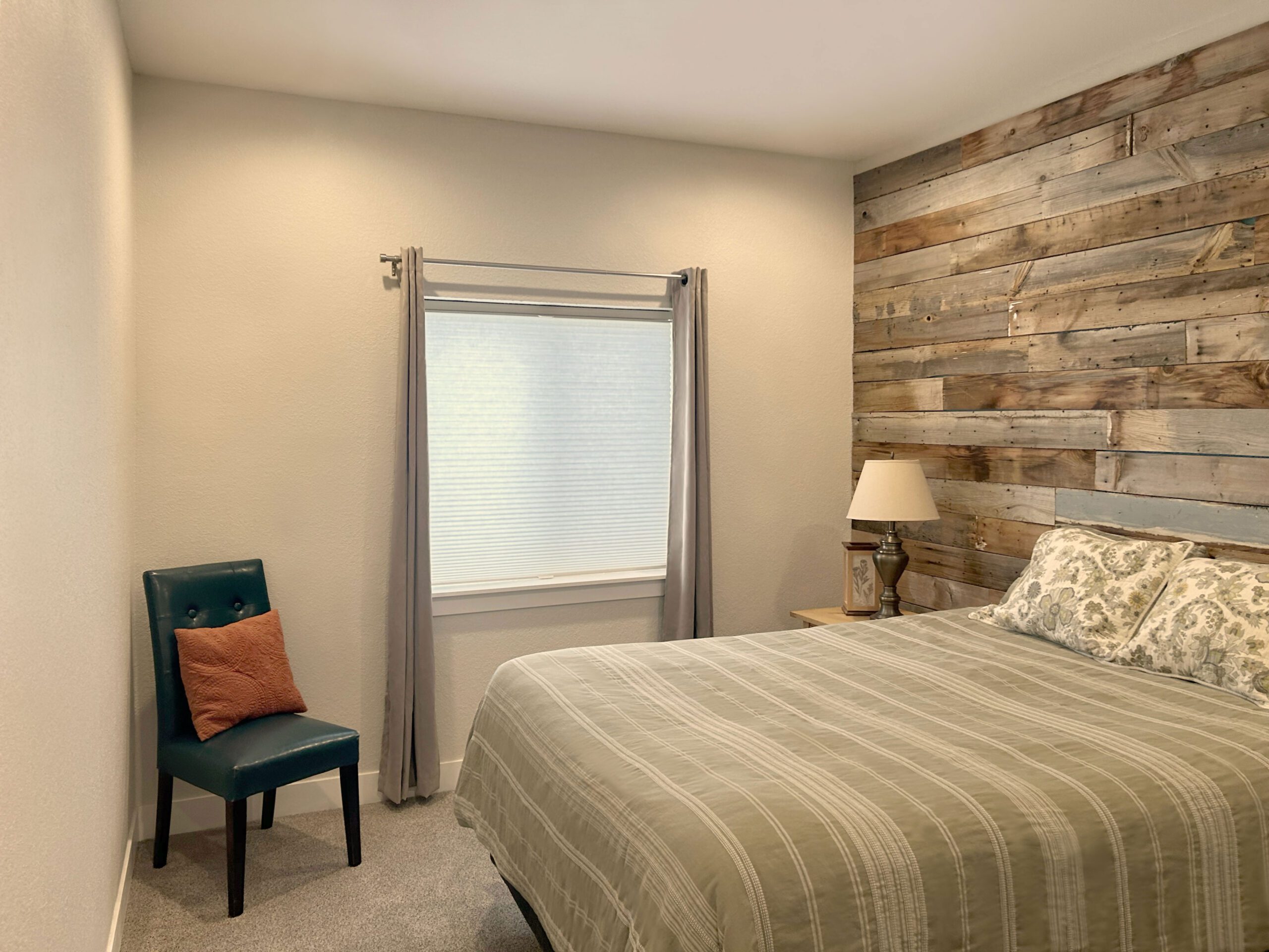 Hunter Douglas Duette Cellular Shades with LiteRise operation, Top-Down/Bottom-Up functionality, and light-filtering fabric paired with curtains for Denver bedroom