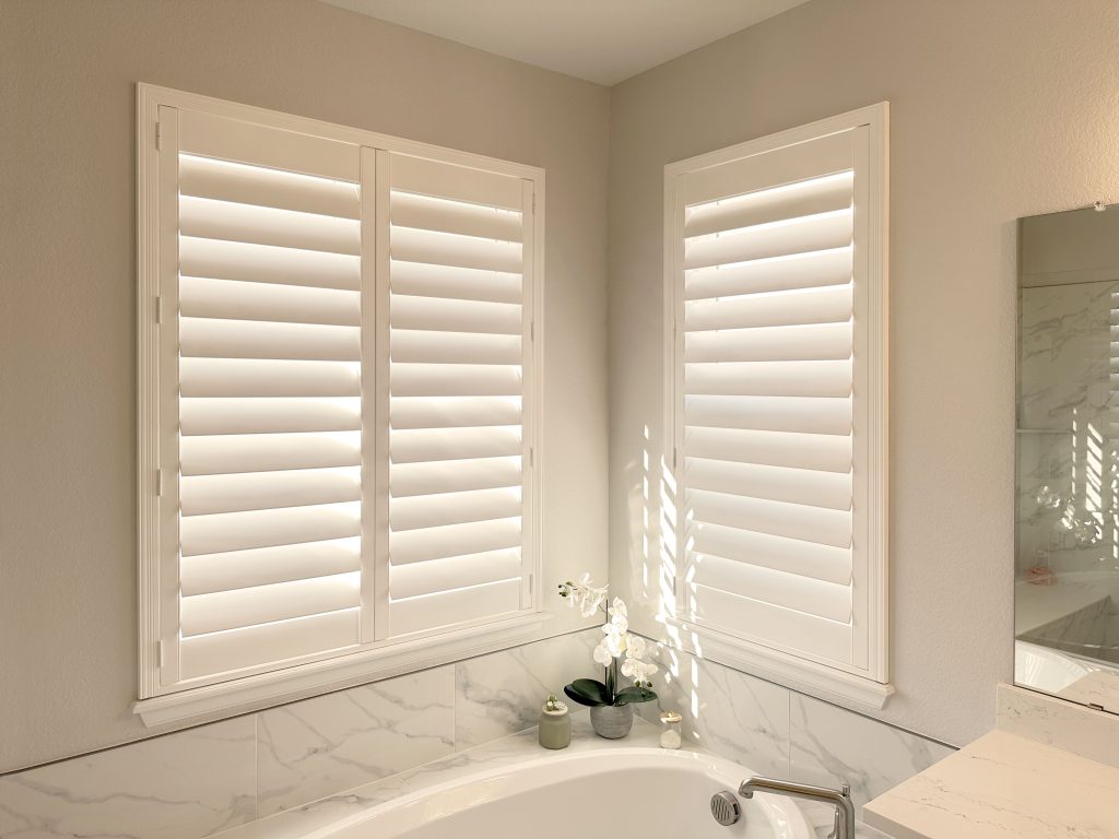 Hunter Douglas Palm Beach Polysatin Shutters in Denver bathroom with hidden tilt system and Z frame design