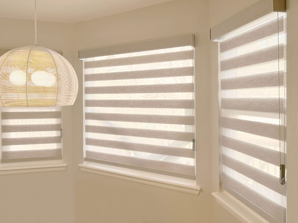 Hunter Douglas Designer Banded Shades with Custom Clutch operation and light filtering fabric in Fort Collins