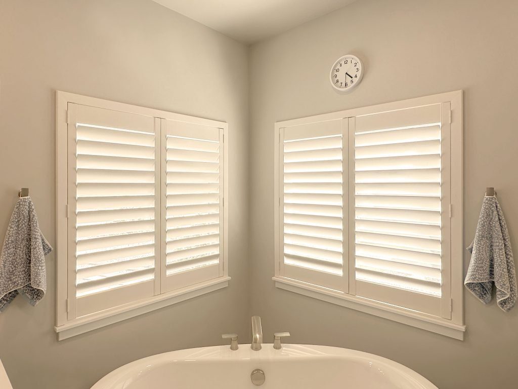 Hunter Douglas Palm Beach Polysatin Shutters with Hidden Tilt system and Z Frame for bathroom in Fort Collins home