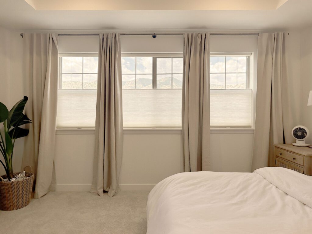 Hunter Douglas Applause Cellular Shades with LiteRise operation, Top-Down/Bottom-Up functionality, and light-filtering fabric provide flexible light and privacy control.