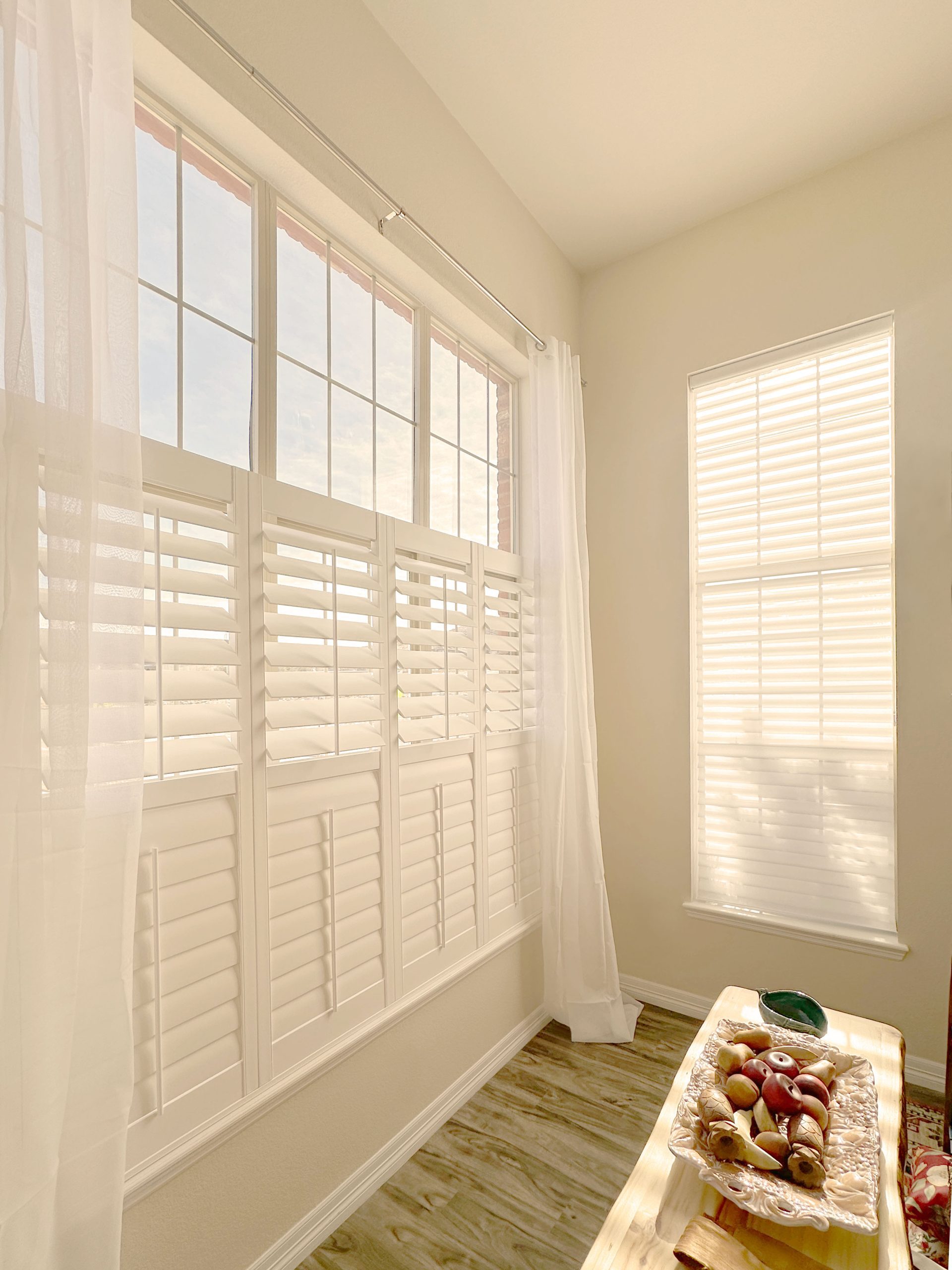 Hunter Douglas Palm Beach Polysatin Shutters with front center tilt control and Z Frame for classic shutter styling in Littleton home