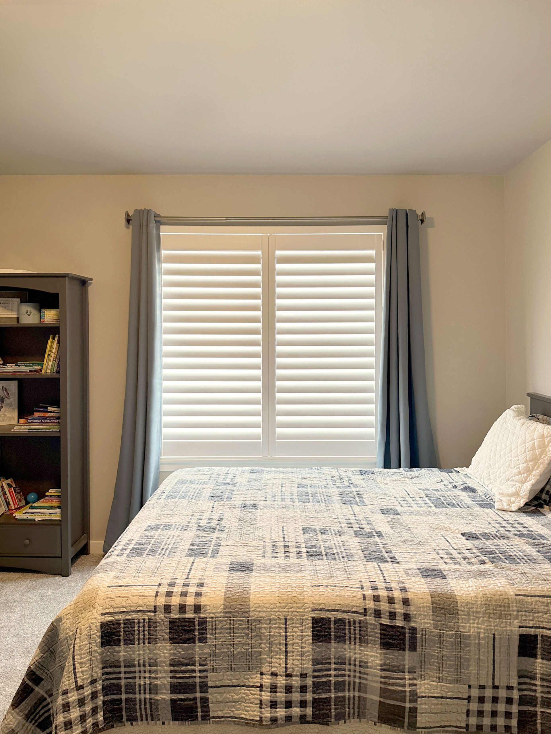 Hunter Douglas Palm Beach Polysatin Shutters with Hidden Tilt system and Z Frame design for bedroom in Littleton home