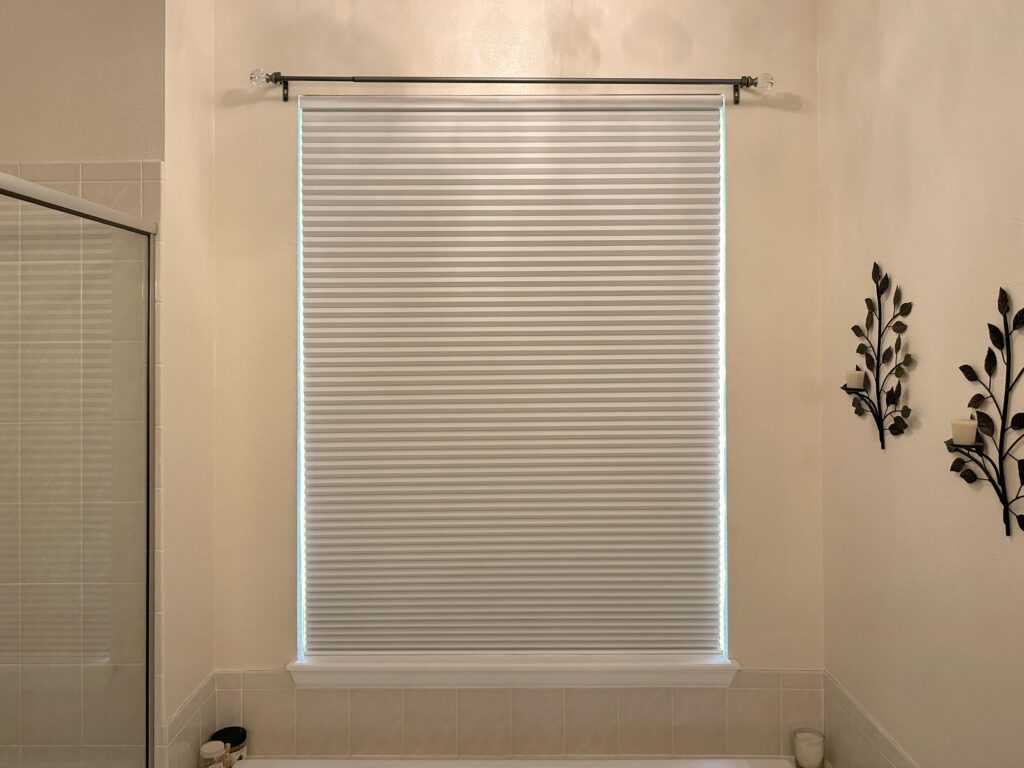 Energy-Efficient Hunter Douglas Applause Cellular Shades with PowerView Automation and Room Darkening fabric for bathroom