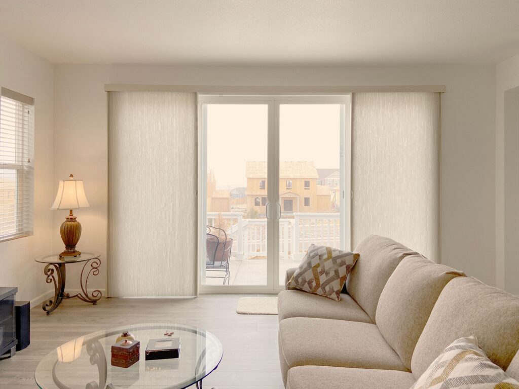 Hunter Douglas Applause Cellular Shades with Vertiglide operation, Split Stack Vertical configuration, and light filtering fabric for Colorado homes