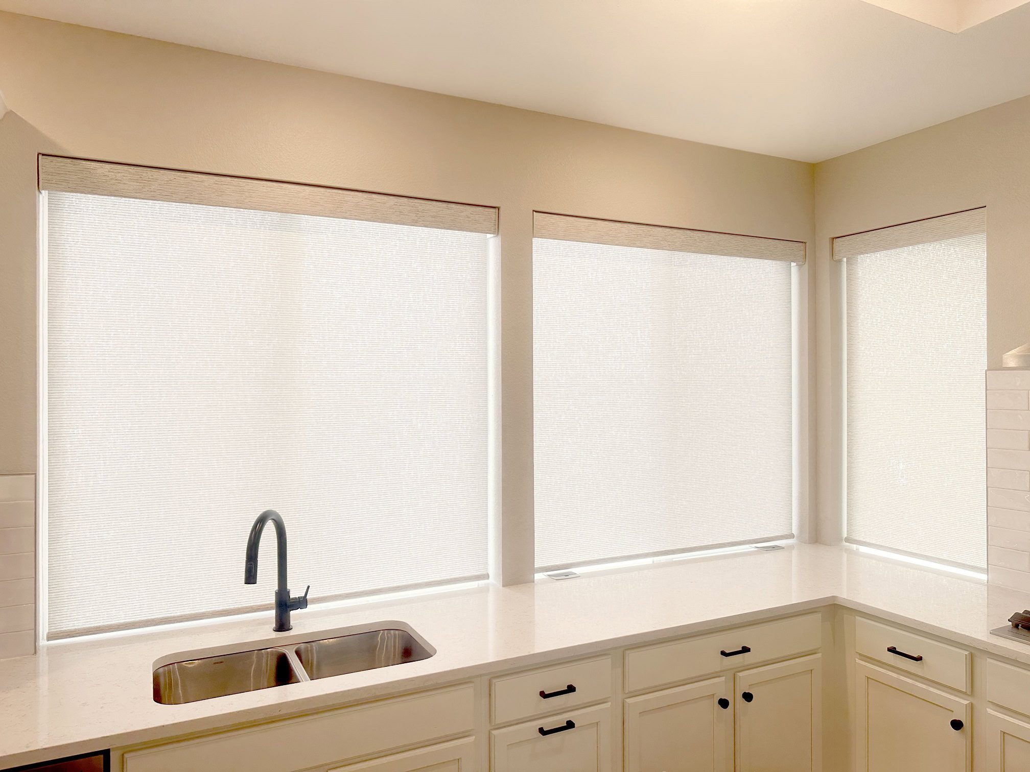 Smart and motorized Hunter Douglas Designer Roller Shades with Light Filtering fabric for large kitchen windows