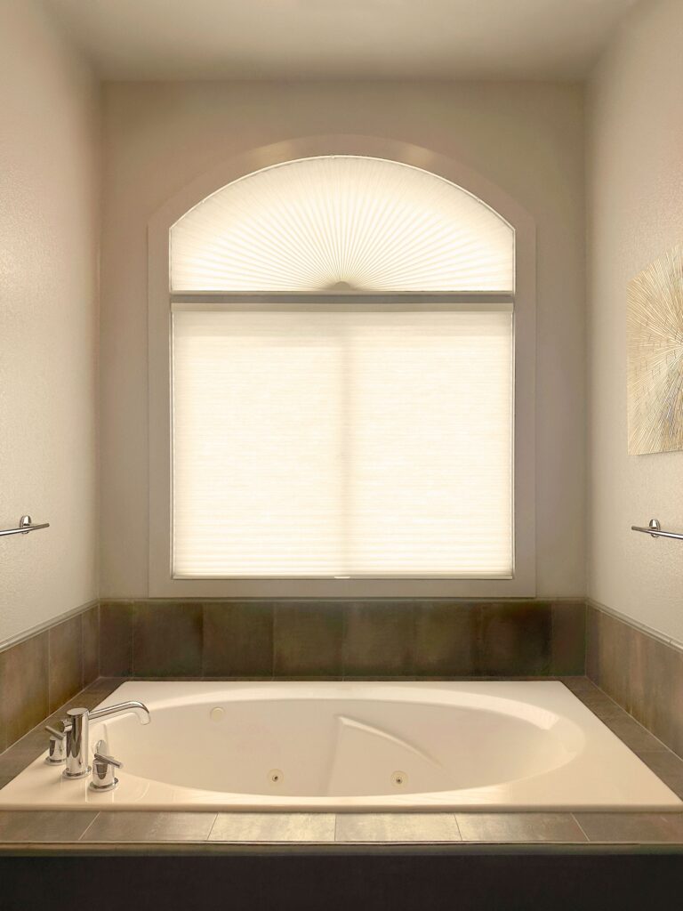 Hunter Douglas Duette Cellular Shades with LiteRise operation, Non-Operable specialty shape design, and Light Filtering fabric for bathroom in Colorado
