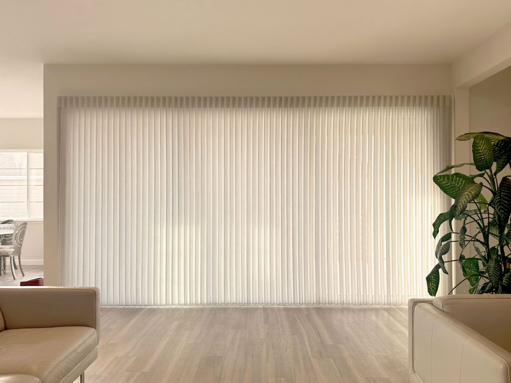 Hunter Douglas Luminette Privacy Sheers with Wand Control, Left Stack Vertical configuration, and light filtering fabric for Colorado homes