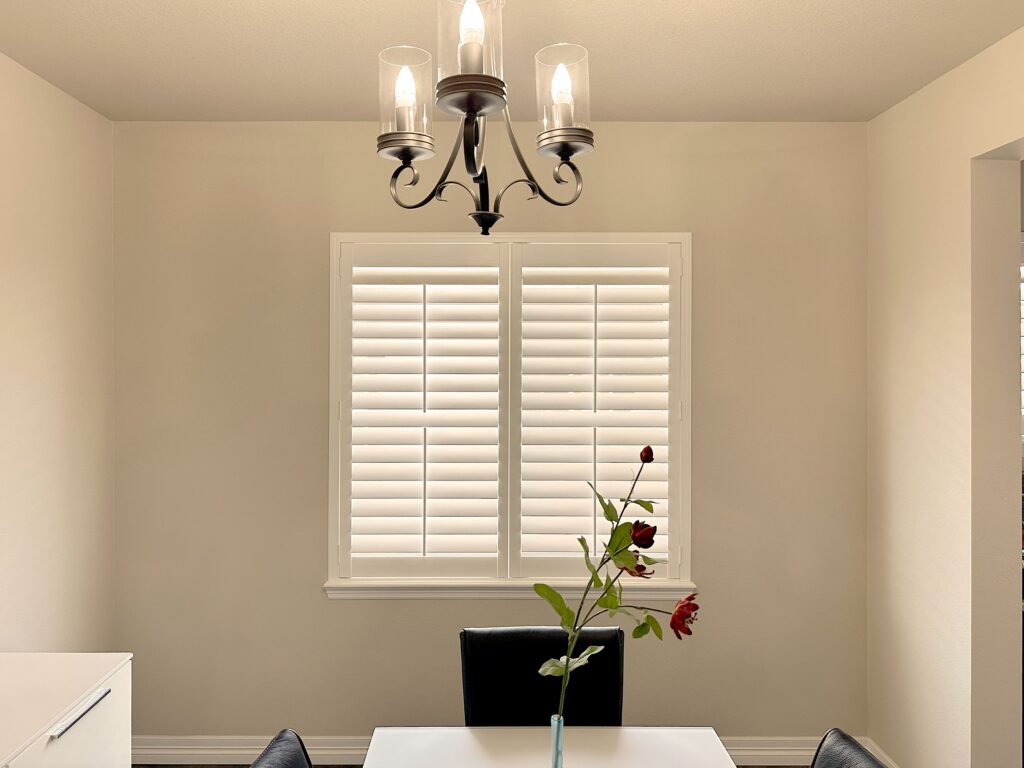 Hunter Douglas NewStyle Hybrid Shutters with Front Center Tilt operation and Z Frame design for Colorado dining room