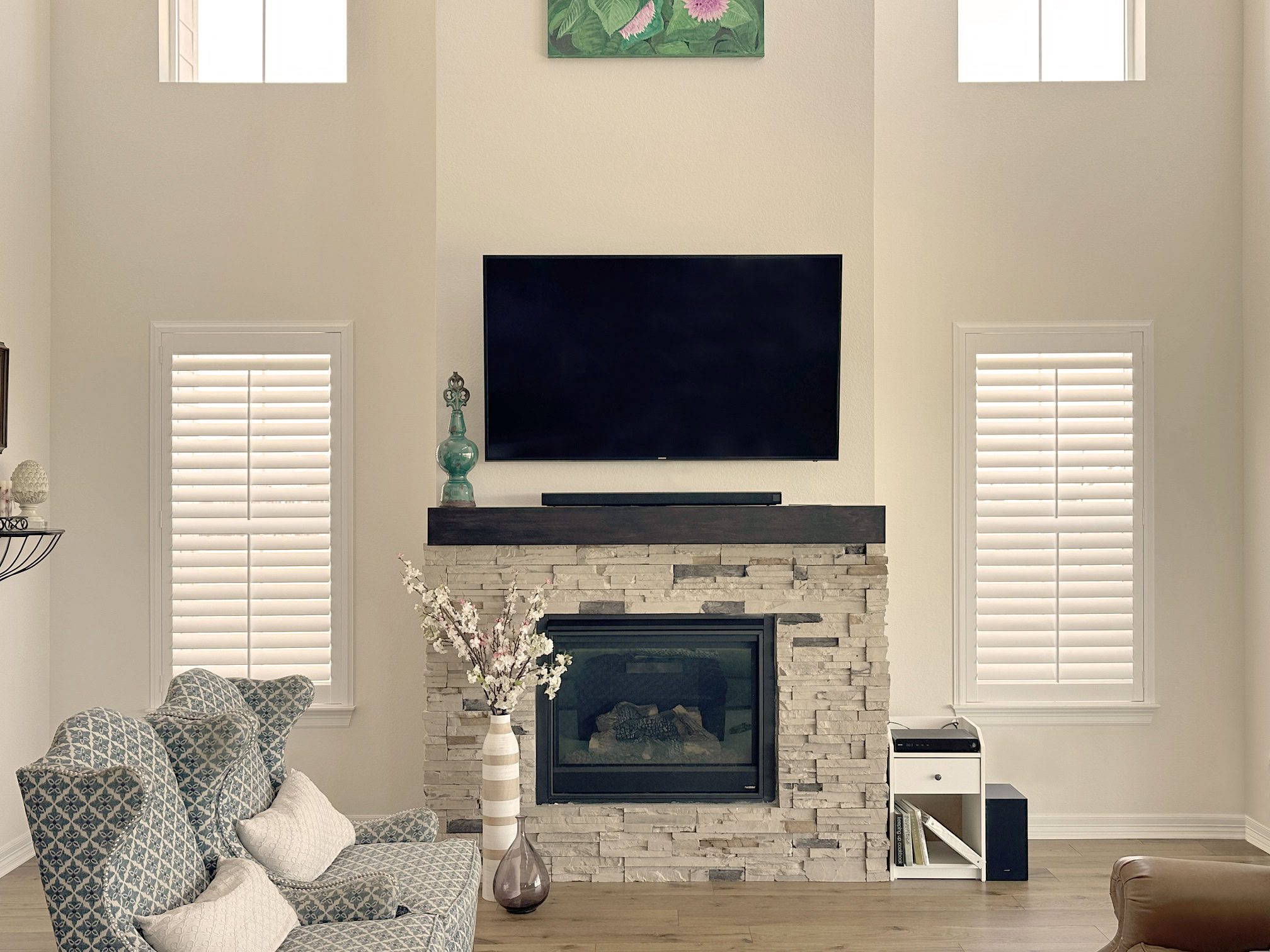 Hunter Douglas NewStyle Hybrid Shutters with Front Center Tilt and Z Frame design for windows near the TV living room in Colorado home