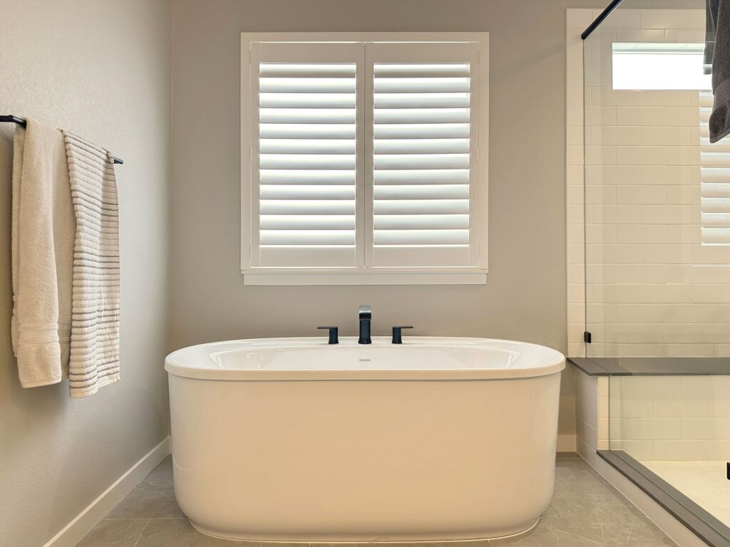 Hunter Douglas Palm Beach Polysatin Shutters with Hidden Tilt and Z Frame construction for bathroom in Colorado