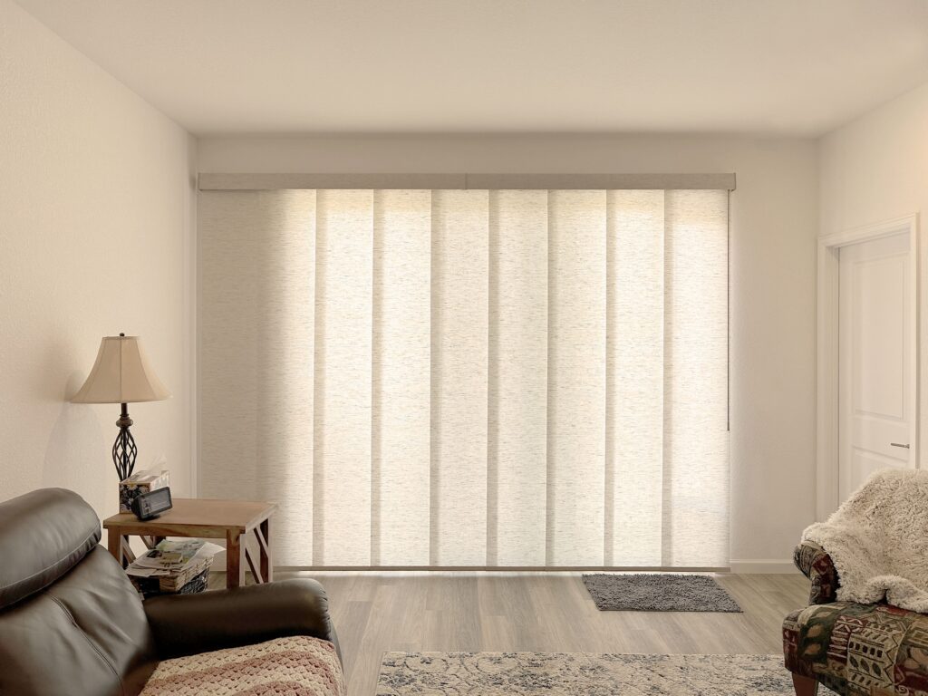 Hunter Douglas Skyline Panel-Track Blinds with Light Filtering fabric, Wand Control, and Left Stack Vertical configuration for large door in Colorado home