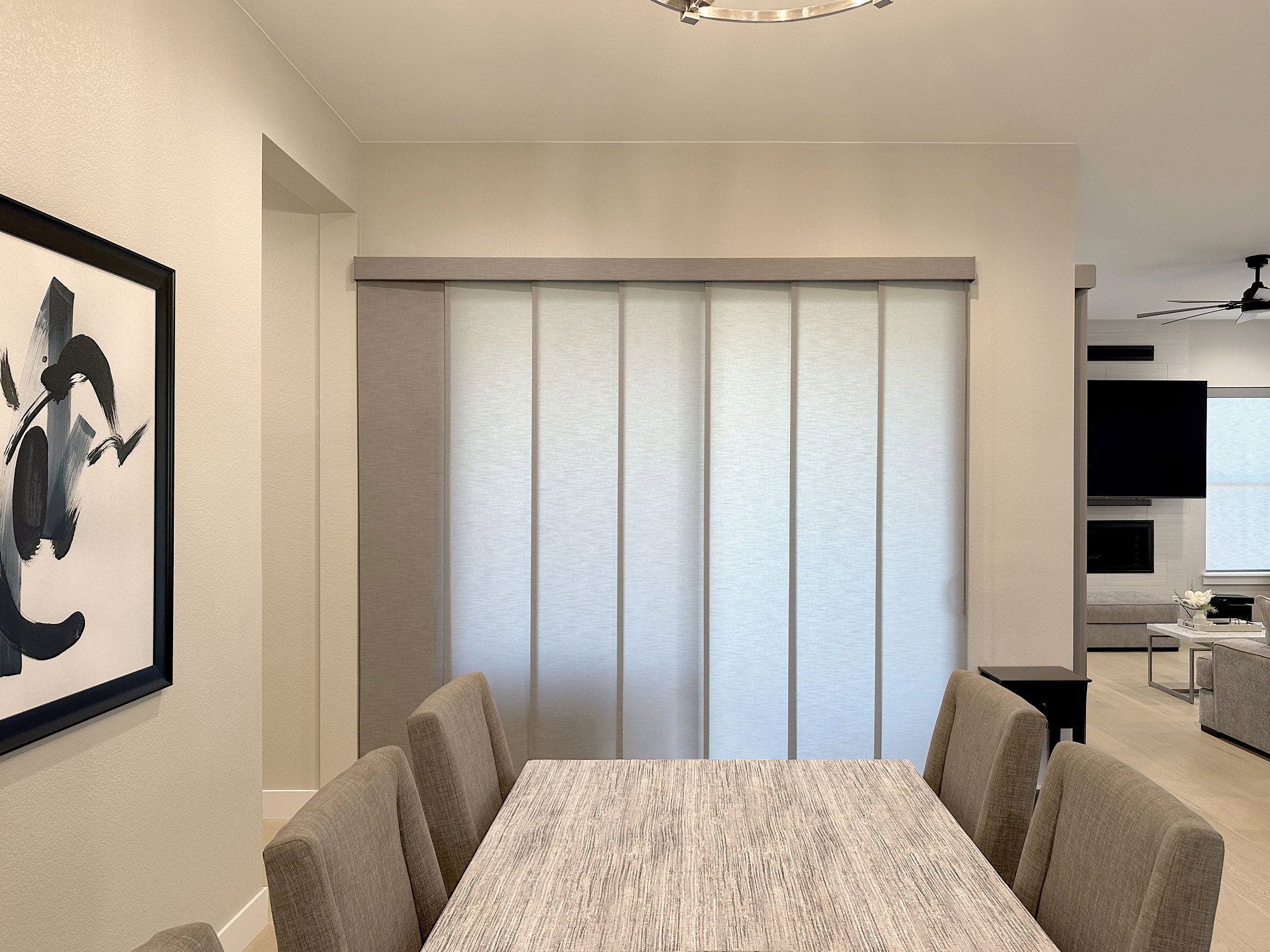 Hunter Douglas Skyline Panel-Track Blinds with wand control, left stack vertical operation, and light filtering fabric panels for Colorado home
