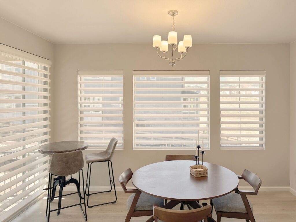 Cordless Hunter Douglas Pirouette Privacy Sheers installed in a Colorado dining room