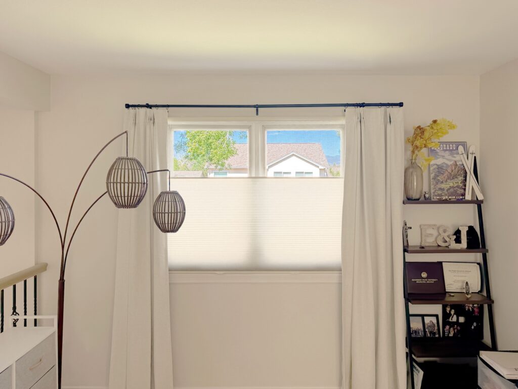 Honeycomb shades layered with curtains for Arvada, CO Home