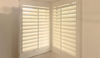 Hunter Douglas Heritance Hardwood Shutters with Front Center Tilt and L Frame design for Colorado home