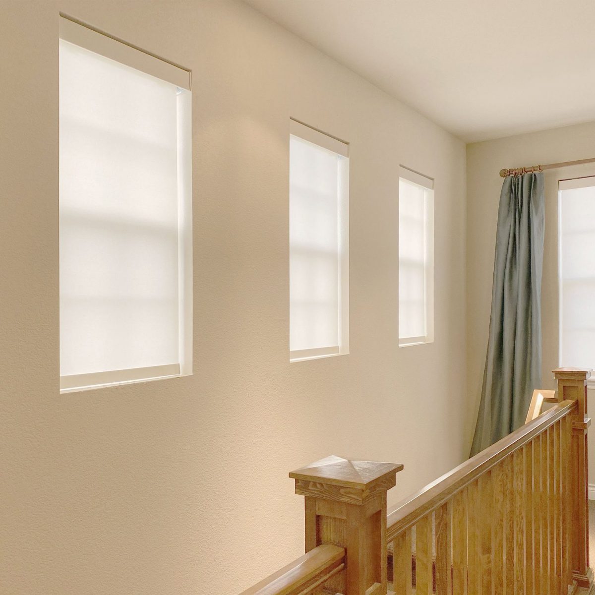 Hunter Douglas Designer Roller Shades with PowerView and Light Filtering features for hard-to-reach windows in Littleton home